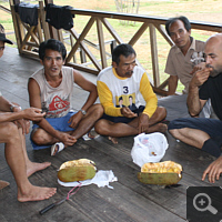 Some Dayaks and me with eating a jackfruit.