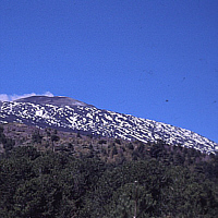 Partly still snow covered Etna (Sicily).