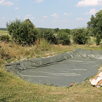 Unfurled pool liner.